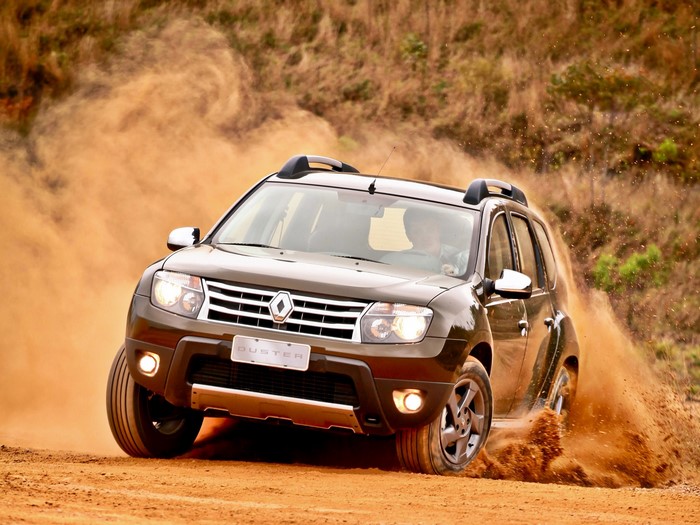Renault Duster driving on a dirt road