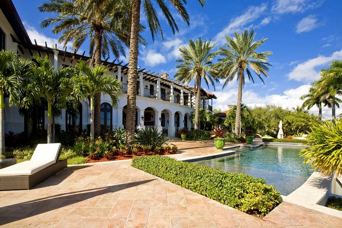 Luxury resort with pool and palm trees