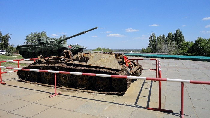 Two tanks on display with a wreath on the front tank