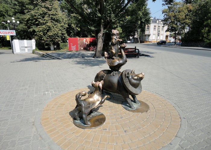 Bronze sculpture of animals in a park