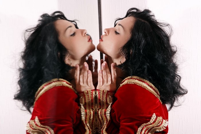 Jenya D in red and gold outfit