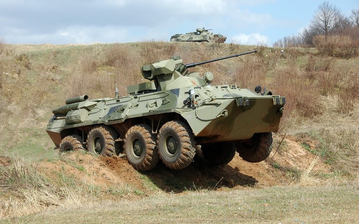 Military APC vehicle on a dirt hill