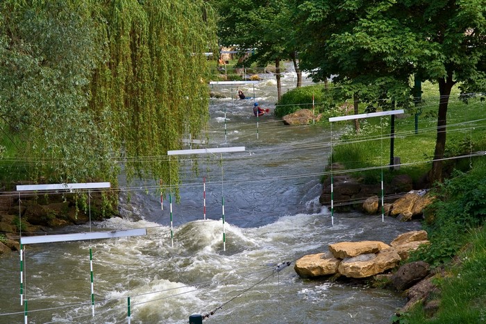 Canoe slalom course with kayakers