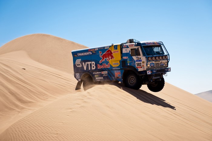 KAMAZ truck racing on sand dunes