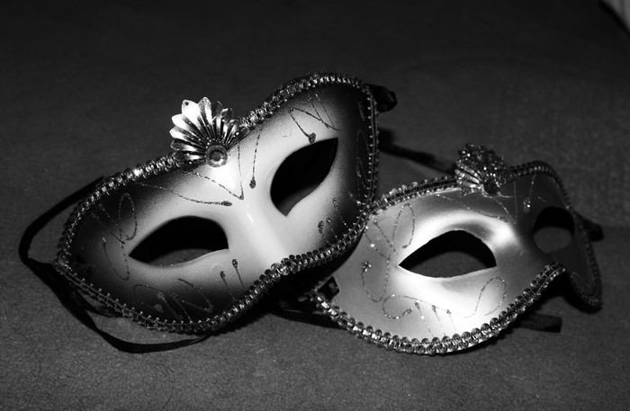 Two Venetian masks with glitter and embellishments