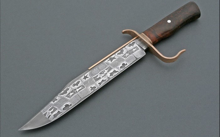 Damascus Bowie knife with ornate blade
