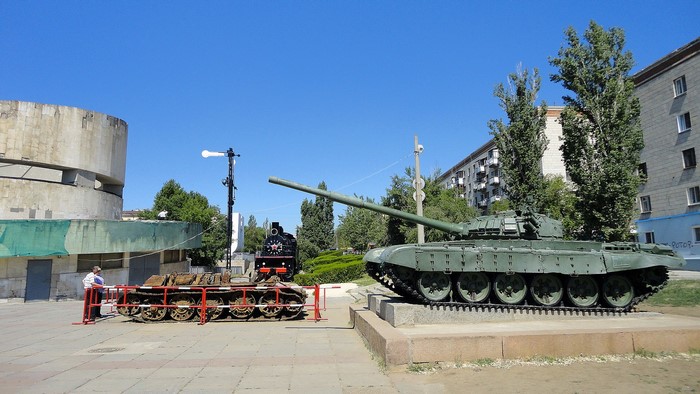 Tanks and a steam locomotive on display