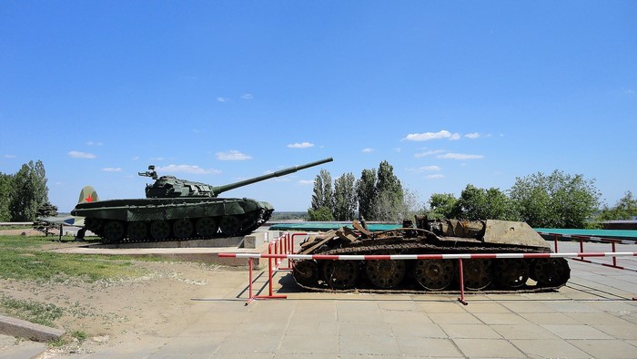 Two tanks on display under a blue sky