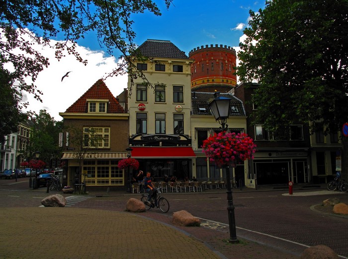 Street view with buildings and a water tower in the Netherlands