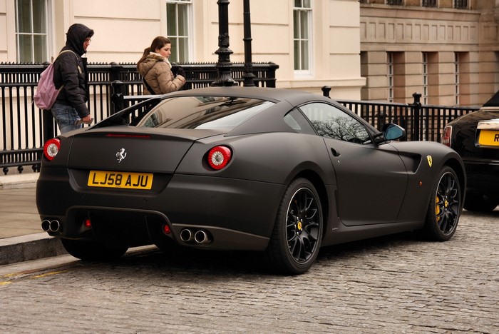 Matt Black Ferrari LJ58 AJU on Cobblestone Street