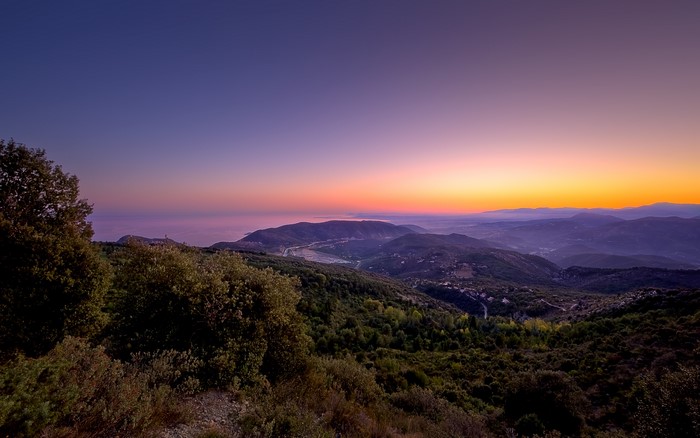 Sunset over mountains and sea