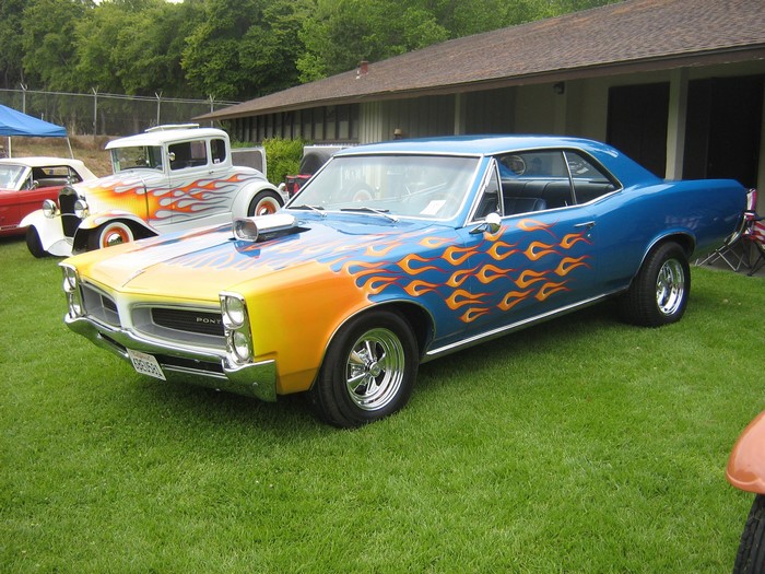 Blue Pontiac with flame graphics