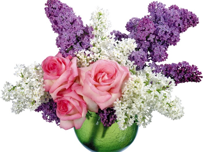 Bouquet of pink roses and lilacs in a green vase