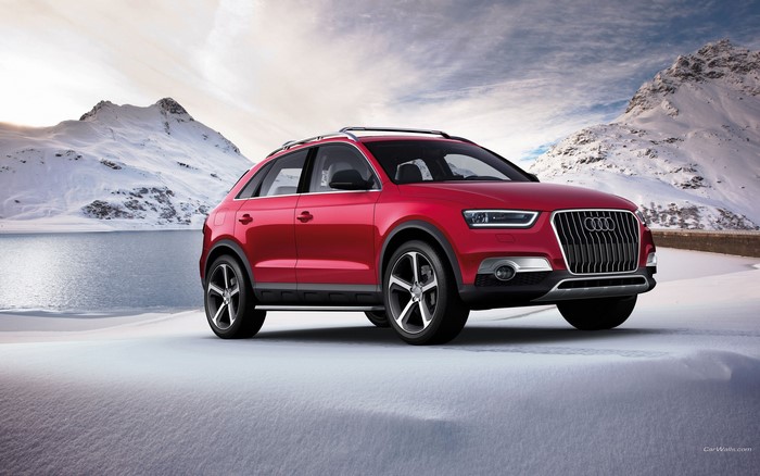 Red Audi Q3 in a Snowy Mountain Landscape