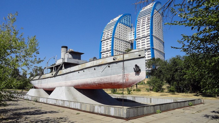 Monumental ship in Volgograd with modern buildings behind