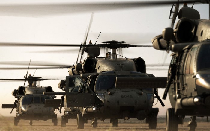 Military helicopters flying in formation
