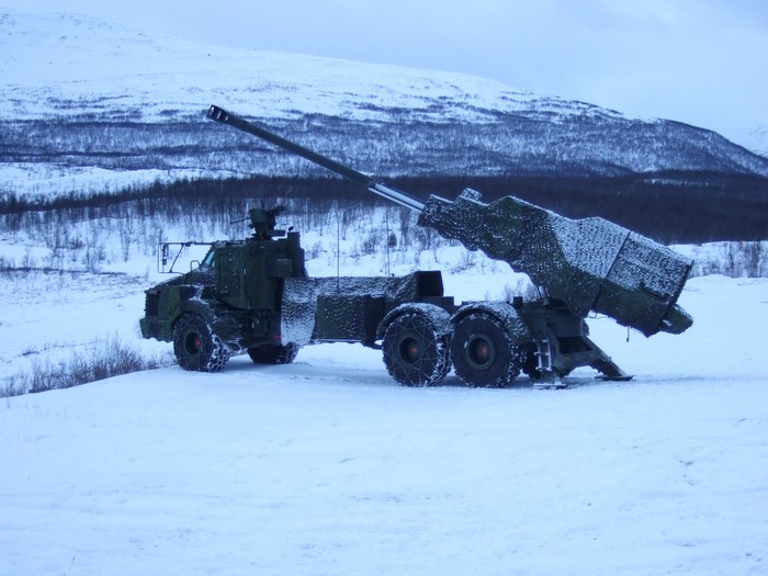 Self-propelled howitzer in a snowy landscape