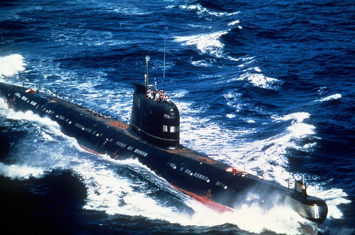 A submarine sailing through choppy blue waters
