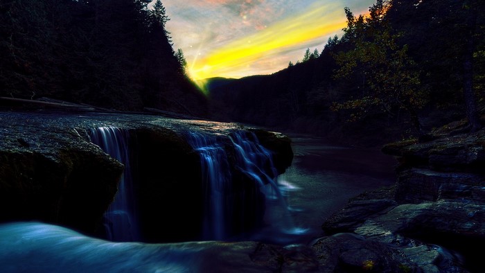 Waterfall at sunset with dramatic sky
