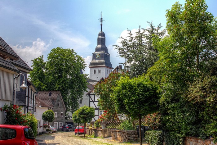 Street in a German town with a church tower