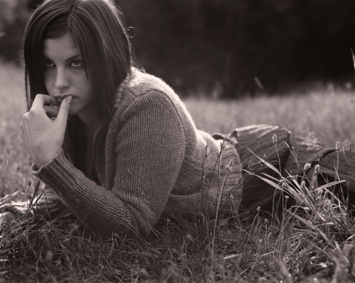 Liv Tyler lying in grass