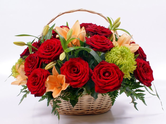 Red roses and lilies in a basket