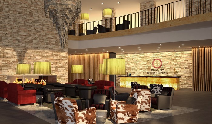 Hotel lobby with stone walls, fireplace, and seating areas