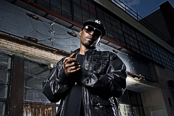 Man wearing sunglasses and a black jacket