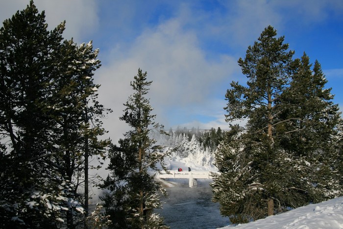 Snowy Yellowstone National Park with a bridge and river