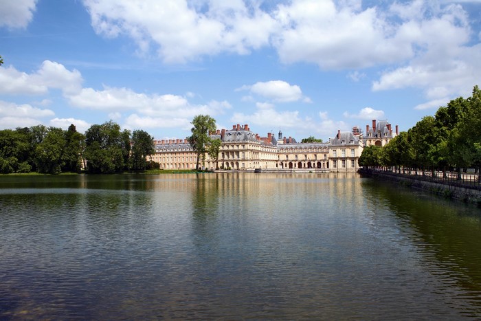 Chateau de Fontainebleau reflected in the pond