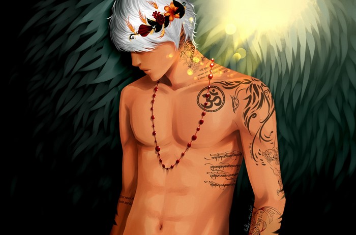Young man with tattoos and flowers in hair