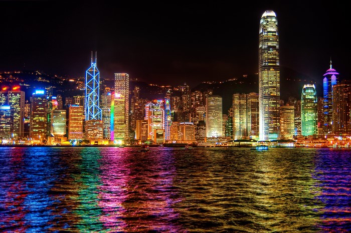 Hong Kong skyline at night with colorful reflections