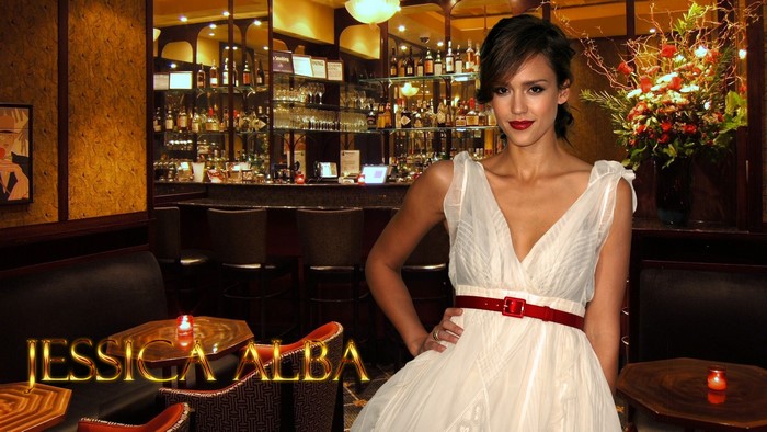 Jessica Alba in a white dress at a bar
