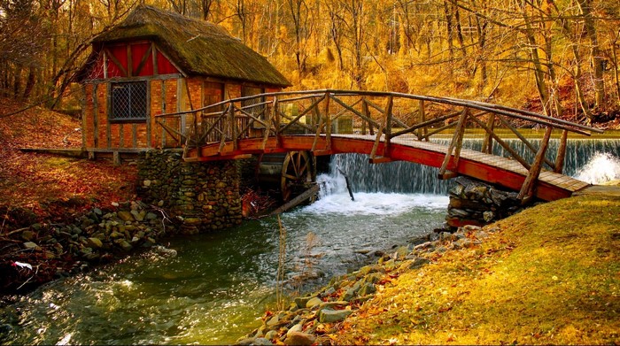 Autumn scene with a water mill and bridge