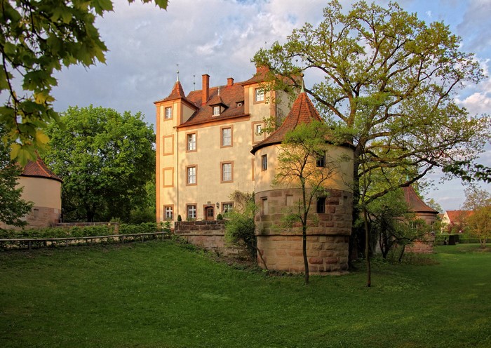 Castle with round towers and trees in Germany