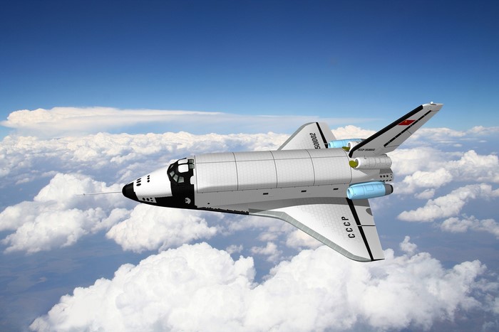 Buran Soviet space shuttle flying above clouds
