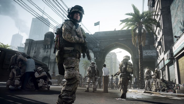 Soldiers in a city street with an arched gateway