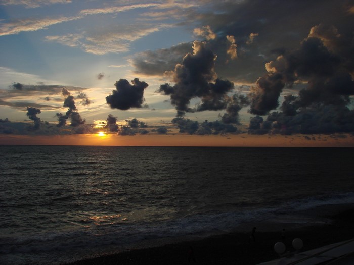 Sunset over the sea with clouds