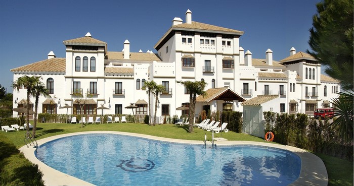 Resort with swimming pool and palm trees