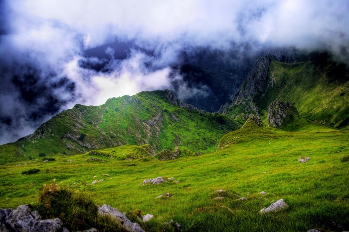Green mountains with dramatic clouds