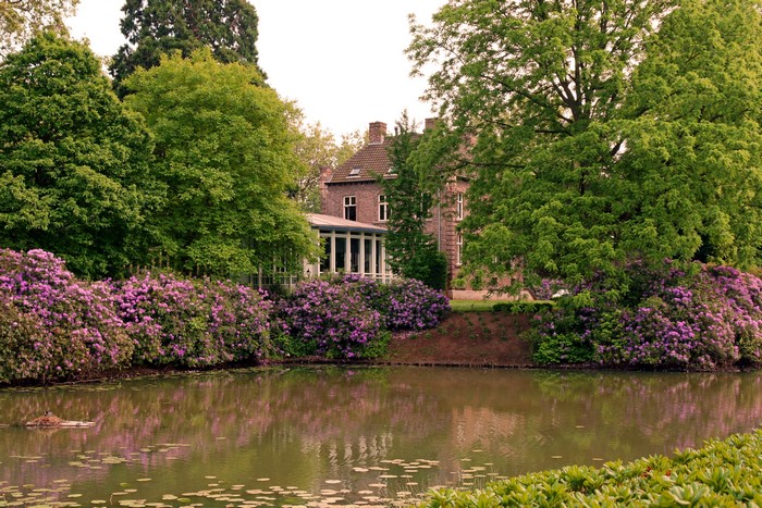 Brick house with conservatory and lake in Netherlands