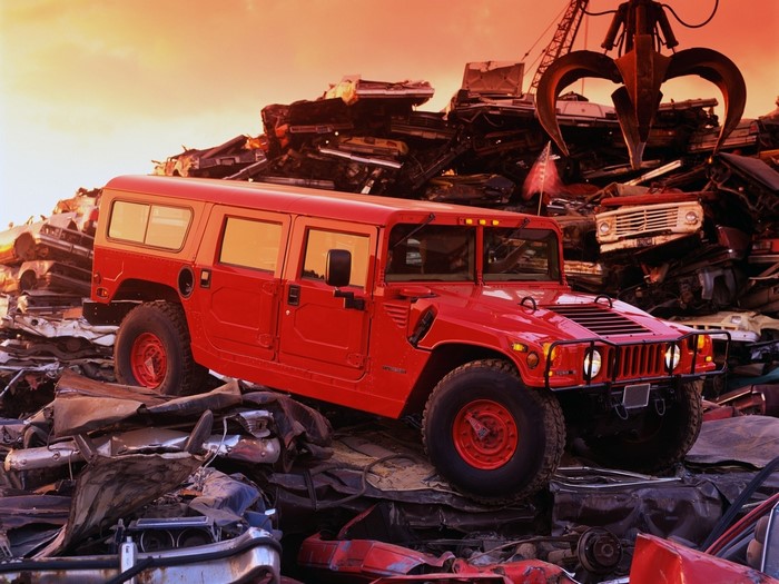Red Hummer in a junkyard