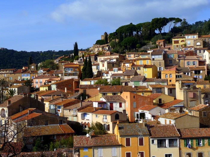Hillside village with terracotta roofs in France