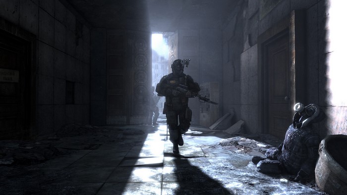 Soldiers in a dark, ruined hallway from Metro 2033