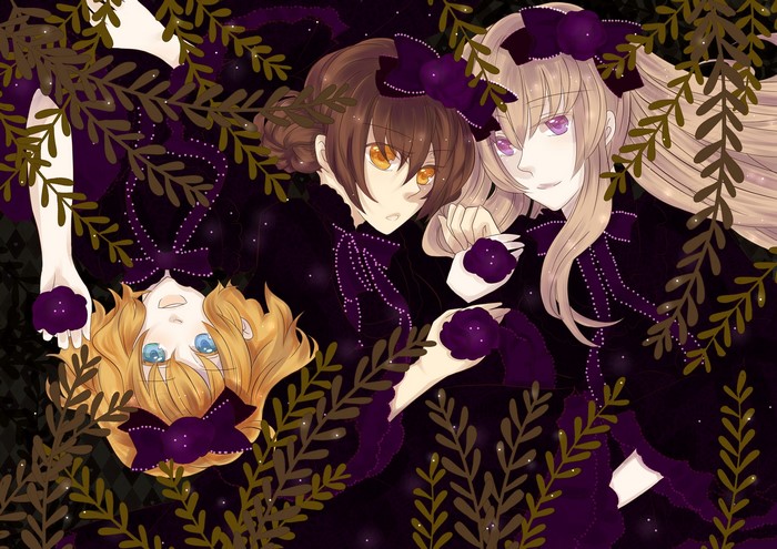 Three girls in dark dresses with purple flowers