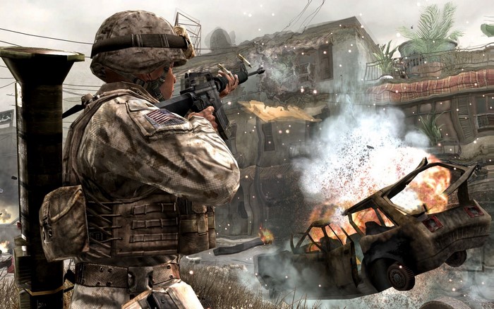 Soldier firing rifle near burning car in Call of Duty 4