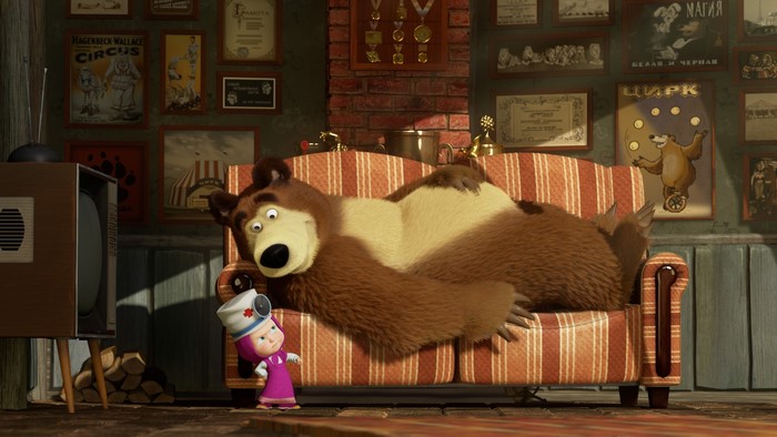 Masha and the Bear on a couch