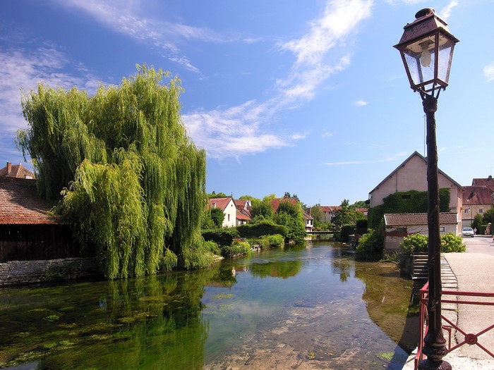 Street lamp by a canal in a French village