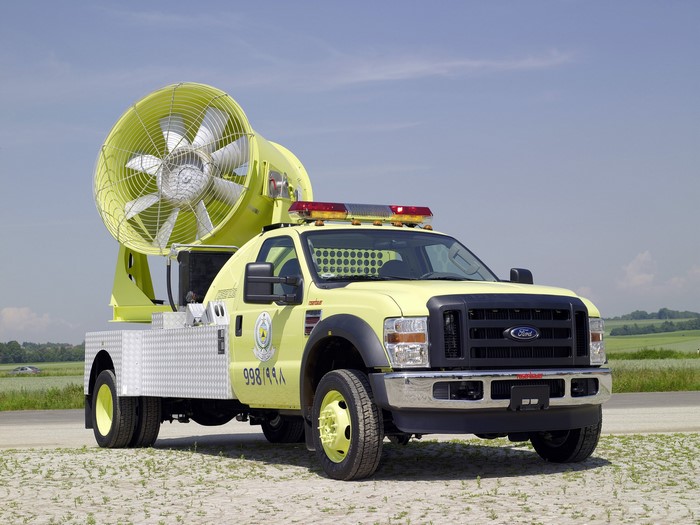 Yellow Ford truck with large fan