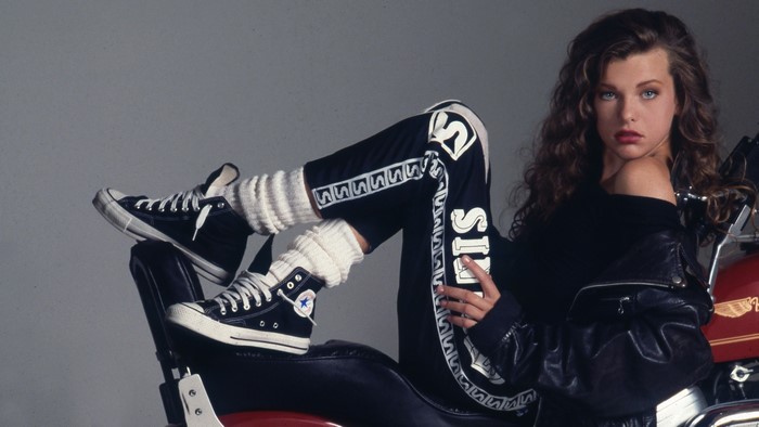 Milla Jovovich posing on a motorcycle